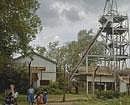 Schoolchildren play in front of an abandoned shaft at Kolar Gold Fields. Reuters