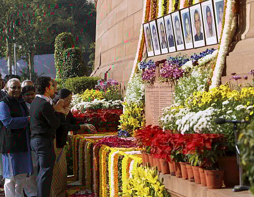 Rajya Sabha member Sachin Tendulkar and other dignitaries paying floral tribute to the martyrs of December 13 Parliament attack on its 12th anniversary, at Parliament House in New Delhi on Friday. PTI Photo