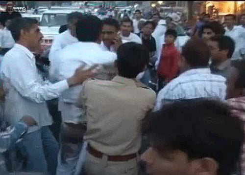 The attacker was caught by AAP supporters who thrashed him badly. Kejriwal was rallying in Charkhi Dadri. Tv Grab