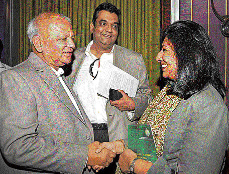 Kiran Mazumdar-Shaw, chairperson of the Vision Group on Biotechnology and CMD of Biocon Ltd (right) greets S R Patil, Minister for IT-BT, at the announcement of Bangalore India Bio 2015 on Wednesday. DH pHOTO