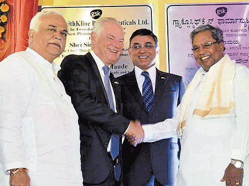 Chief Minister Siddaramaiah shakes hand with UK Minister of State for Trade and Investment Lord Francis Maude during the foundation laying ceremony of GSK Pharmaceuticals at Vemgal Industrial Area in Kolar on Tuesday.