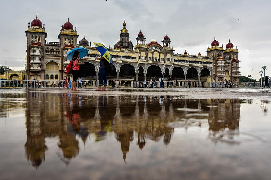 The Ambavilas palace is reflected in rain water. Volvo buses will ferry the tourists to nine palaces in and around the city. The fare includes food, entry fee to the palaces and bus charge. DH file photo