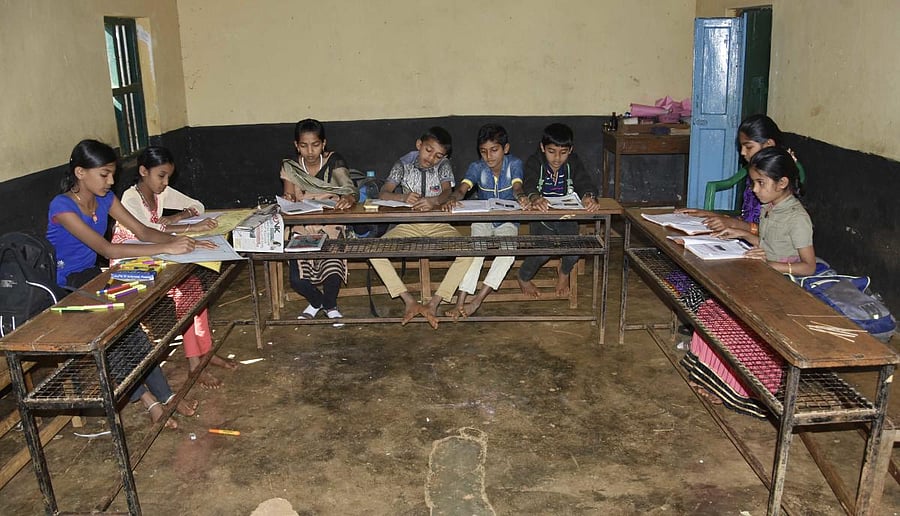 Just a handfull: A school in Aralagodu GP limits registers poor attendance. dhphoto