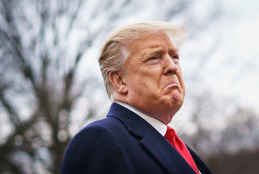 TOPSHOT - US President Donald Trump speaks to reporters before boarding Marine One on the South Lawn of the White House in Washington, DC on March 22, 2019. - Trump is heading to Florida for meeting with Caribbean leaders at his Mar-a-Lago estate. (Photo