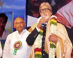 Amitabh Bachchan speaks at a function after presenting Nandi Awards 2013 in Hyderabad on Thursday. Also seen in the picture is Andhra Pradesh Chief Minister Kiran Kumar Reddy. PTI Photo