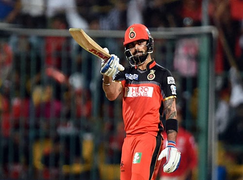 Royal Challengers Bengaluru Captain Virat Kohli celebrates his century against Kings XI Punjab during the VIVO IPL T20 2016 Match at Shri M Chinnaswamy Stadium in Bengaluru on Wednesday. DH photo