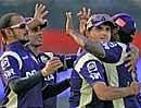 Kolkata Knight Riders captain Sourav Ganguly celebrates with teammates after taking the wicket of Manish Pandey during the IPL match against Bangalore Royal Challengers in Kolkata on Sunday. PTI