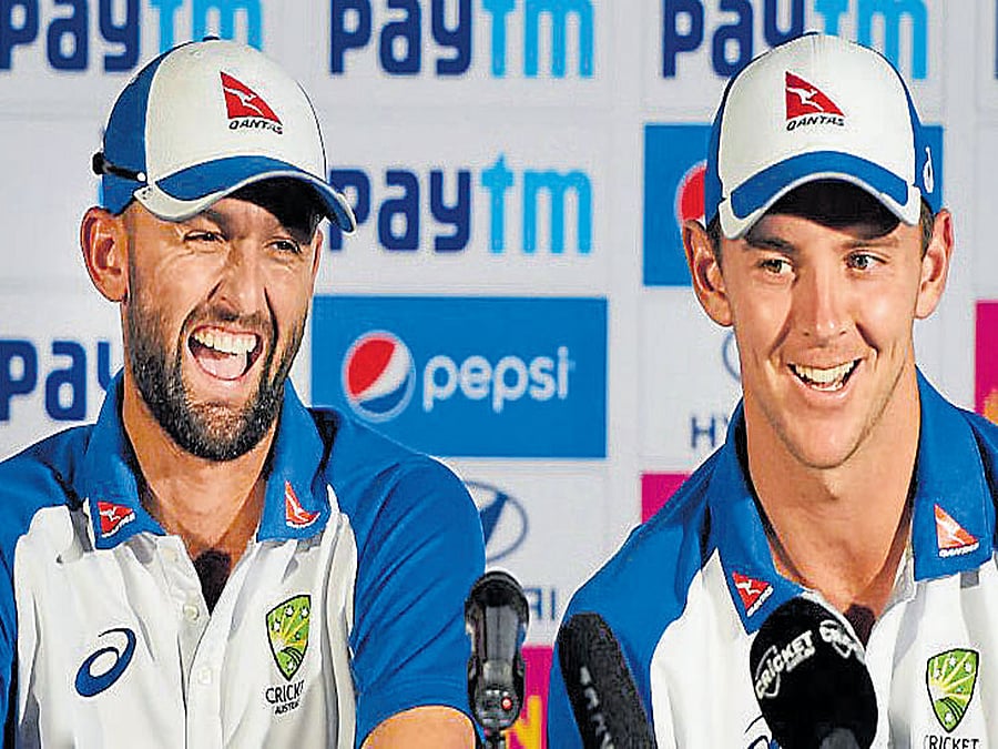 That's a good one Australia's Nathan Lyon (left) and Josh Hazlewood during a media interaction on Tuesday. PTI