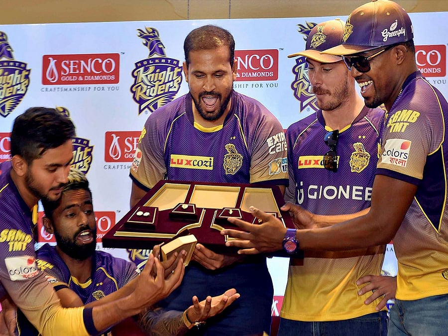 KKR cricketers Yusuf Pathan,Surya Kumar Yadav,Manish Pandey,Darren Bravo and Chris Lynn unveil special KKR collection jewelery during Senco Gold & Diamonds now official jewelery partner of KKR for IPL 2017 in Kolkata on Monday. PTI Photo