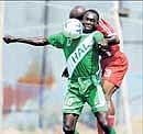 HASCs Fredrick Okwagbe (foreground) battles for possession with Malabar Uniteds Emmanuel Ajaawa in the I-League Division II match in Bangalore on Monday. DH PHOTO