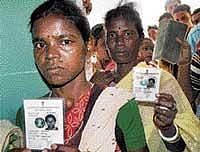 right to vote: Voters stand in queue at a polling booth to exercise their franchise in Giridih district of Jharkhand on Wednesday. PTI