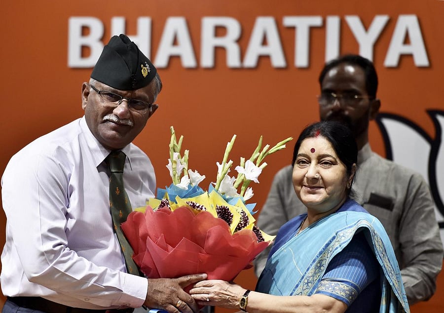 BJP senior leader Sushma Swaraj welcomes Lieutenant General (retd) Sarath Chand as he joins the party in New Delhi on Saturday. (PTI Photo/Ravi Choudhary)