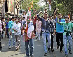 TMCP (Trinamool Congress Chhatra Parishad) activists holding a protest over the heckling of party chief Mamata Banerjee and Amit Mitra by Left activists, in Kolkata on Wednesday. PTI Photo