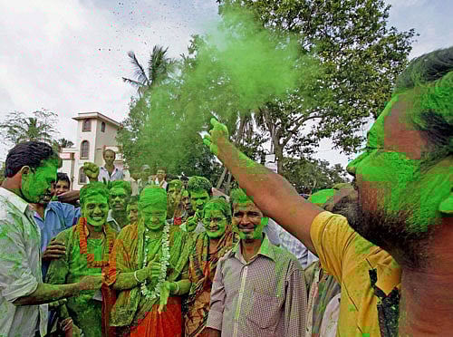 Supporters celebrate the victory of Trinamool Congress supported independent candidate Prasanta Mukherjee in panchayat elections at Bolpur in Birbhum district of West Bengal on Monday. PTI Photo