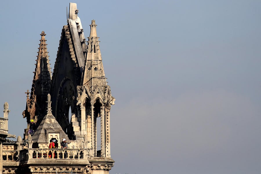 Men work to strengthen a part of Notre-Dame Cathedral after a massive fire devastated large parts of the gothic structure in Paris. REUTERS photo
