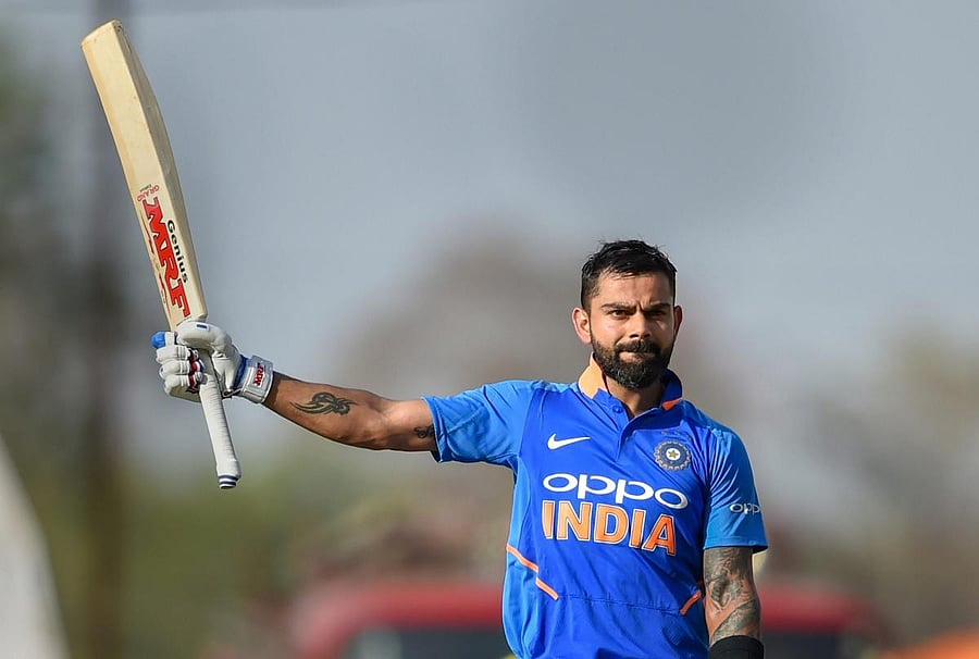 India's Virat Kohli celebrates after reaching his century during the 2nd ODI against Australia at Vidarbha Cricket Association Stadium in Nagpur. PTI photo