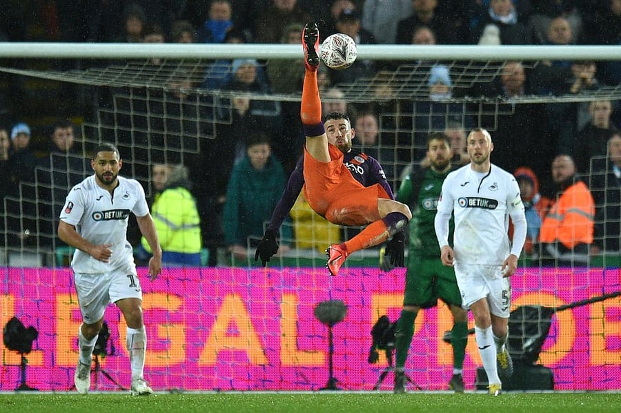 Manchester City's Nicolas Otamendi attempts an overhead kick during their FA Cup quarterfinal game against Swansea City on Saturday. AFP