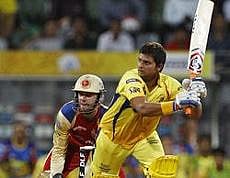 Chennai Super Kings' Suresh Raina, right, bats during Indian Premier League (IPL) Qualifier 1 cricket match between Royal Challengers Bangalore and Chennai Super Kings in Mumbai, India, Tuesday, May 24, 2011. AP Photo
