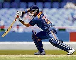 on the charge: Suresh Raina essays a drive to the off-side during his hundred against South Africa during their World T20 face-off in Gros Islet on Sunday. AP