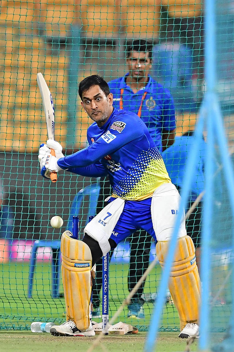FOCUSED CSK skipper Mahendra Singh Dhoni during a practice session, ahead of their Sunday's match against RCB in Bengaluru on Saturday. DH Photo/ Ranju P
