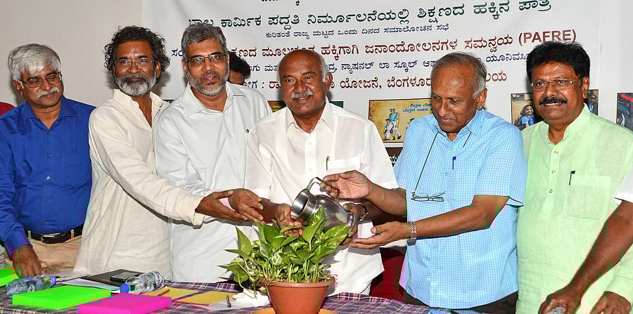 MLA H Vishwanath and child rights activist Niranjan Aradhya at a panel discussion on RTE on Tuesday. DH photo/Ranju P