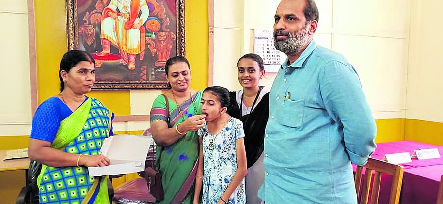 Sinchana Lakshmi being congratulated by her mother.