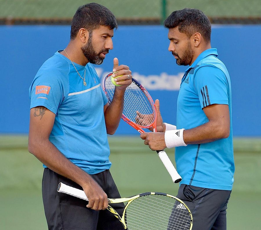 Rohan Bopanna (left) and Divij Sharan could be axed from TOPS after deciding to part ways following a series of first-round exits. PTI