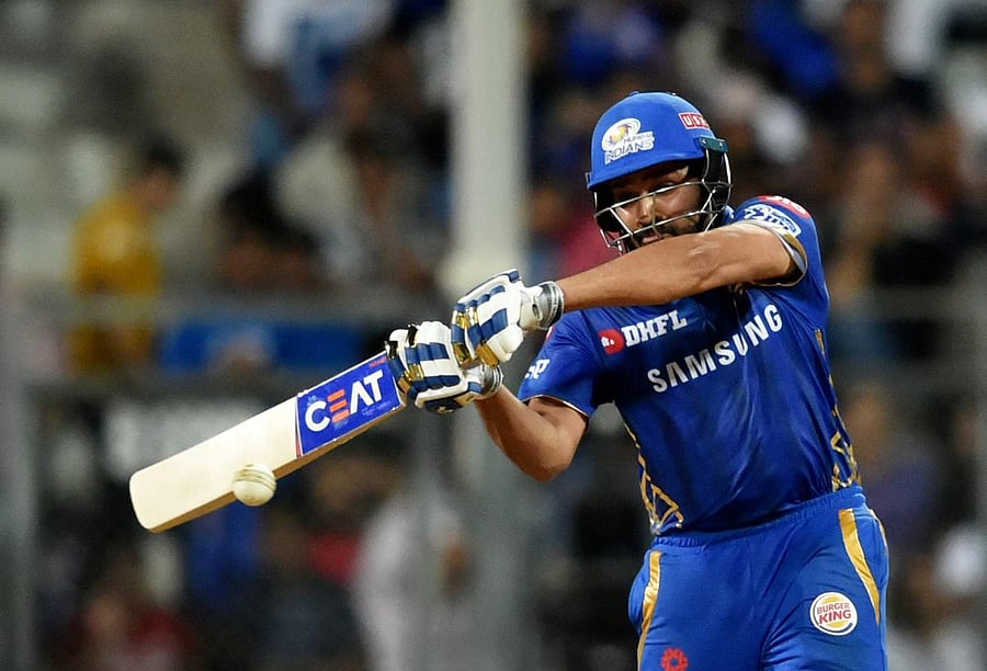 HIT MAN: Mumbai Indians captain Rohit Sharma hammers one to the fence during his unbeaten 55 against Kolkata Knight Riders in the IPL tie in Mumbai on Sunday. Mumbai won the match by nine wickets. PTI
