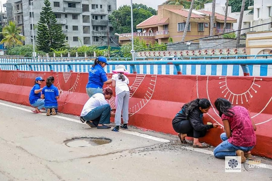 Members of Youth For Parivarthan clean up and paint walls on weekends.