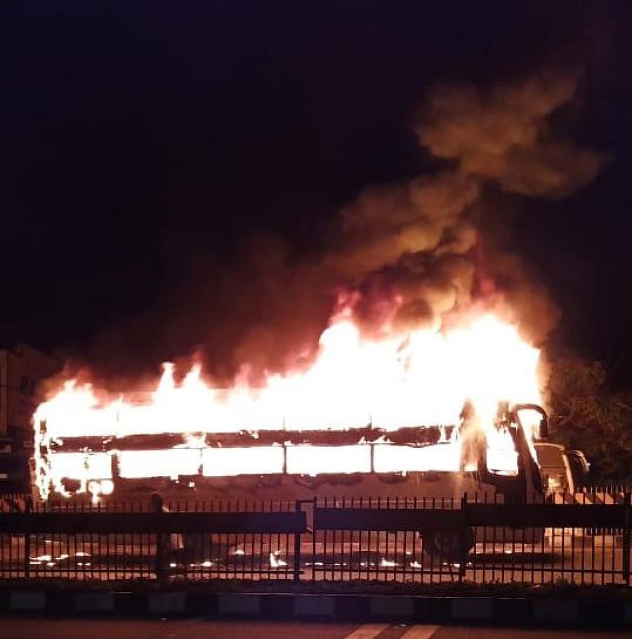 An SRS Travels bus in flames near Kyatasandra on Saturday. DH Photo