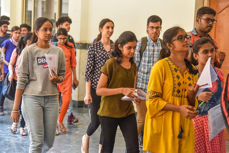 Students come out after writing the Comed-K exam at a centre in Bengaluru on Sunday.dh photo