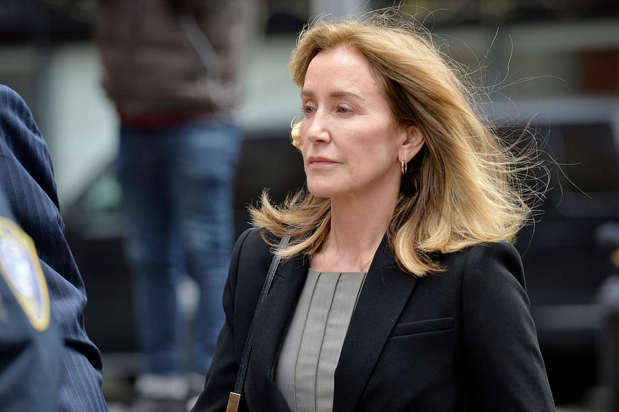 Actress Felicity Huffman is escorted by Police into court where she is expected to plead guilty to one count of conspiracy to commit mail fraud and honest services mail fraud before Judge Talwani at John Joseph Moakley United States Courthouse in Boston,