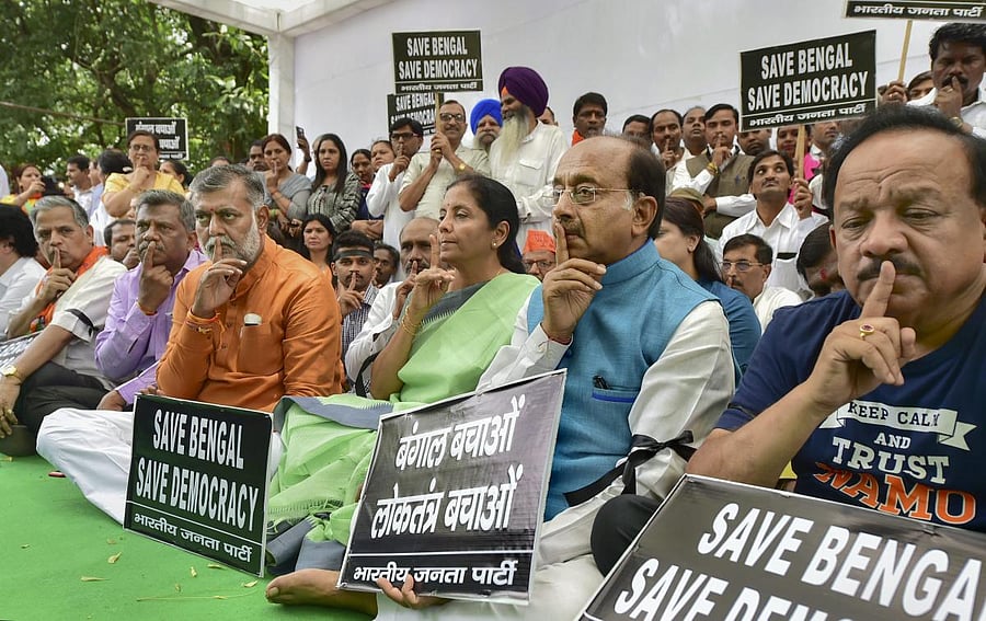 BJP leaders Harsh Vardhan, Vijay Goel, Nirmala Sitharaman and others take part in a silent protest against the clashes that broke out during BJP President Amit Shah's roadshow in Kolkata yesterday, in New Delhi, Wednesday, May 15, 2019. (PTI Photo)
