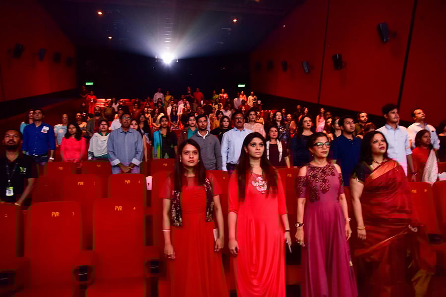 Audience at Vega City, Bannergatta Road, rise for the national anthem. dh photo by B H Shivakumar
