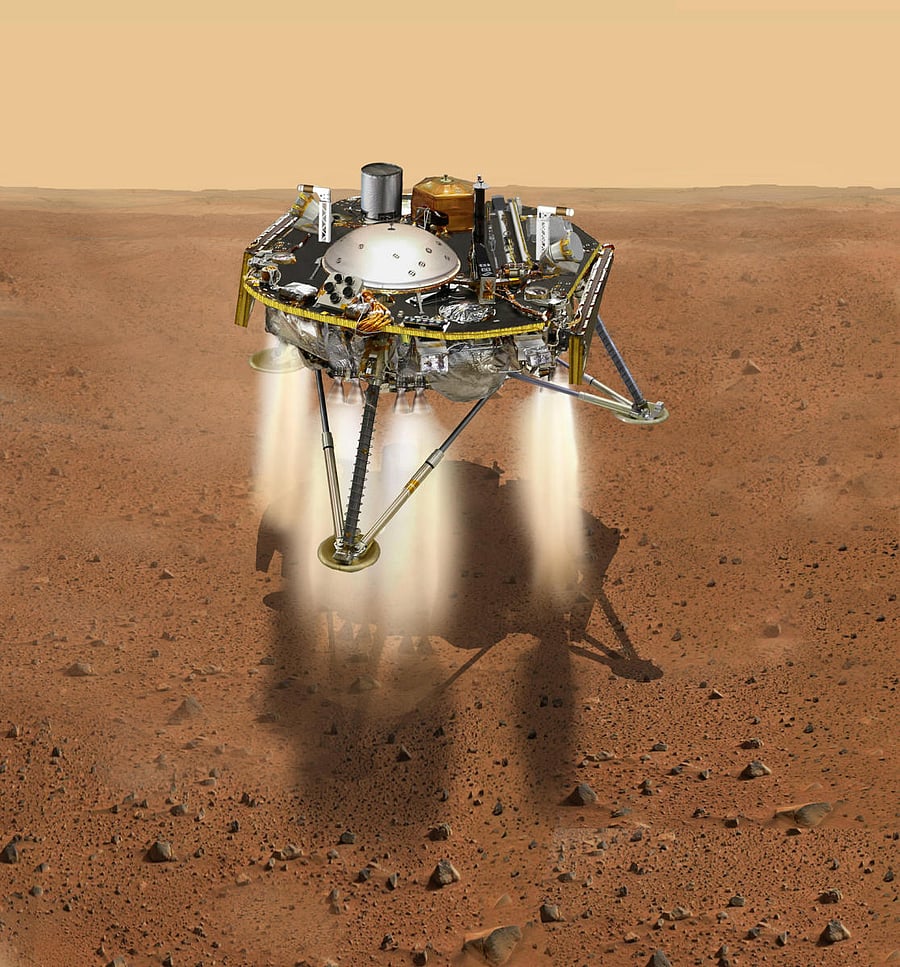 This NASA illustration recieved on November 21, 2018 shows a simulated view of NASA's Interior Exploration using Seismic Investigations, Geodesy and Heat Transport (InSight) lander firing retrorockets to slow down as it descends toward the surface of Mars