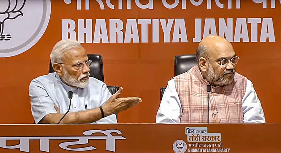 Congress chief spokesperson Randeep Surjewala tweeeted, "Modi ji's first and last press conference became Amit Shah's crutches...one hour speech, tired journalists and sermons to them, no question, no answer." PTI photo