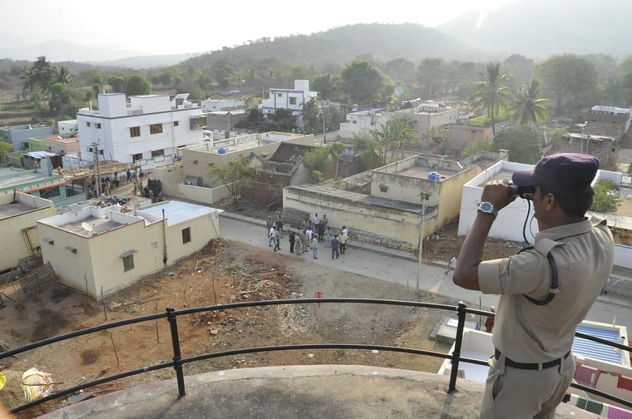 A security personnel keeps vigil in the Chandragiri Assembly constituency.