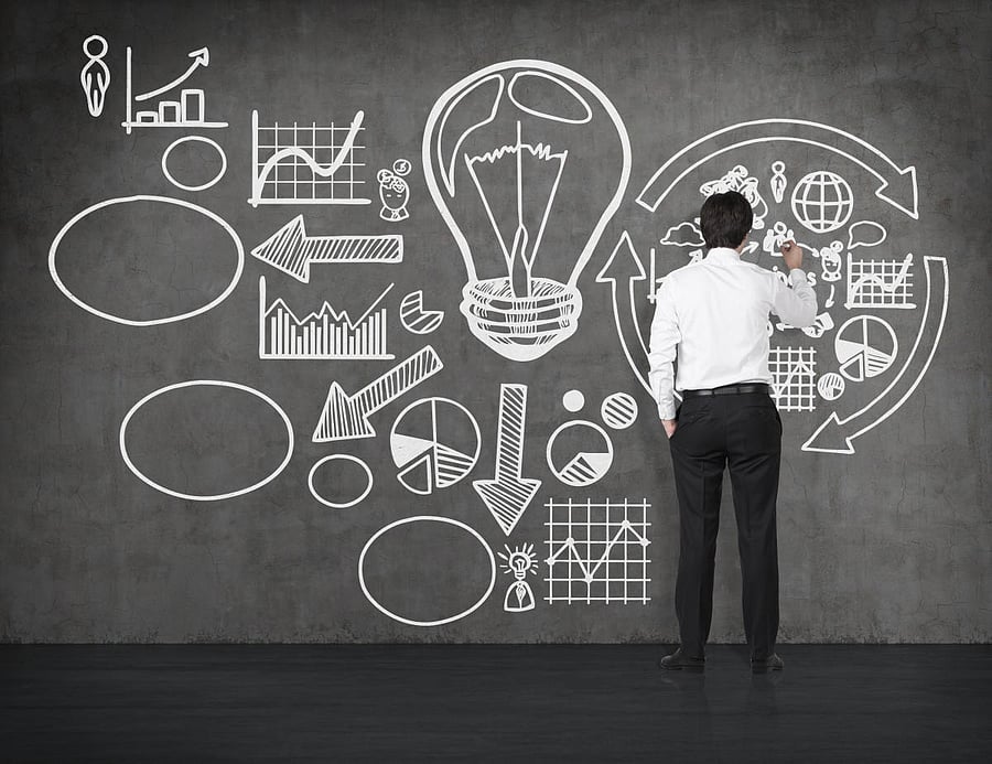 businessman drawing success concept on wal