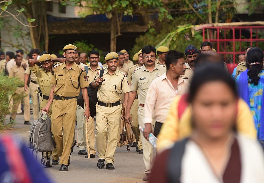Indian Police personnel and other officials get ready ahead of 7th phase of elections. (AFP File Photo)
