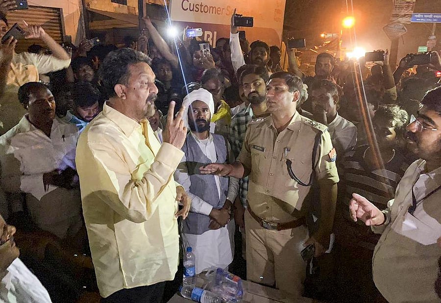 Samajwadi Party-Bahujan Samaj Party joint candidate from Ghazipur, Afzal Ansari, stages a protest outside the strongroom, alleging that the administration was trying to change EVMs, in Ghazipur, on May 20, 2019. PTI