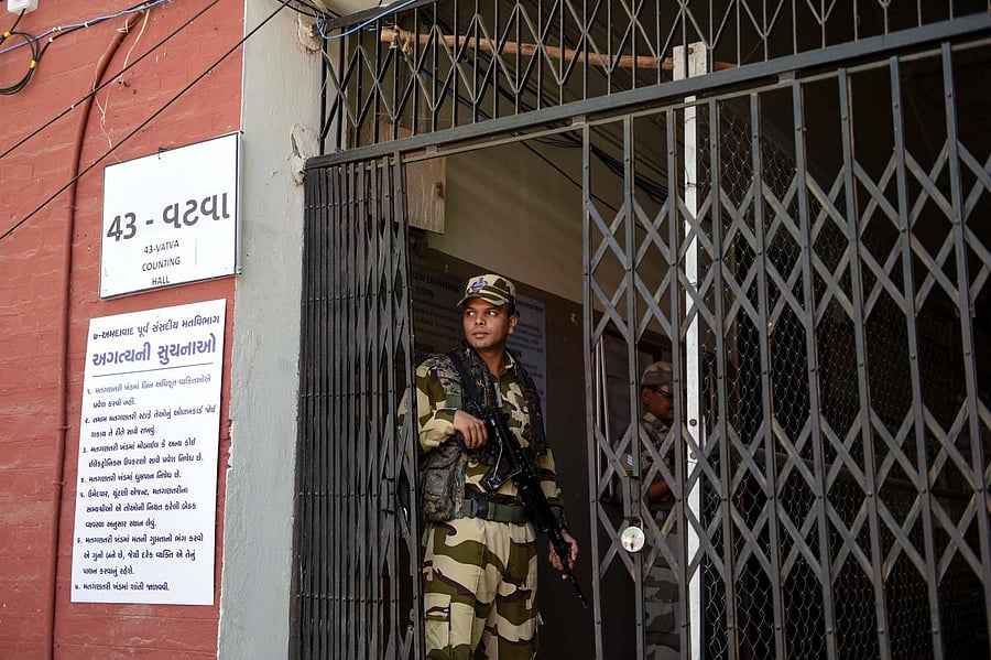 An Indian paramilitary soldier from the Central Industrial Security Force (CISF) stands guard at a counting centre. (Photo AFP)
