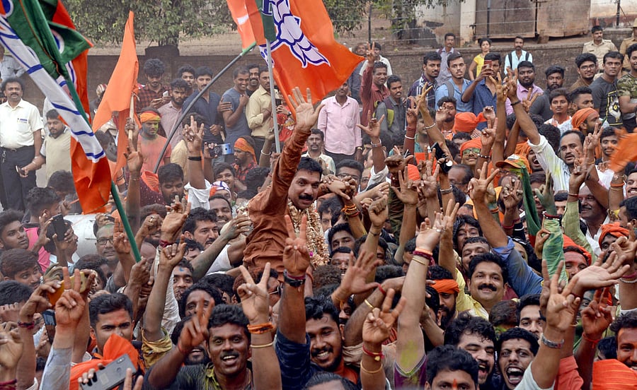 Supporters lift Nalin Kumar Kateel of BJP who won from Dakshina Kannada constituency. DH PHOTO