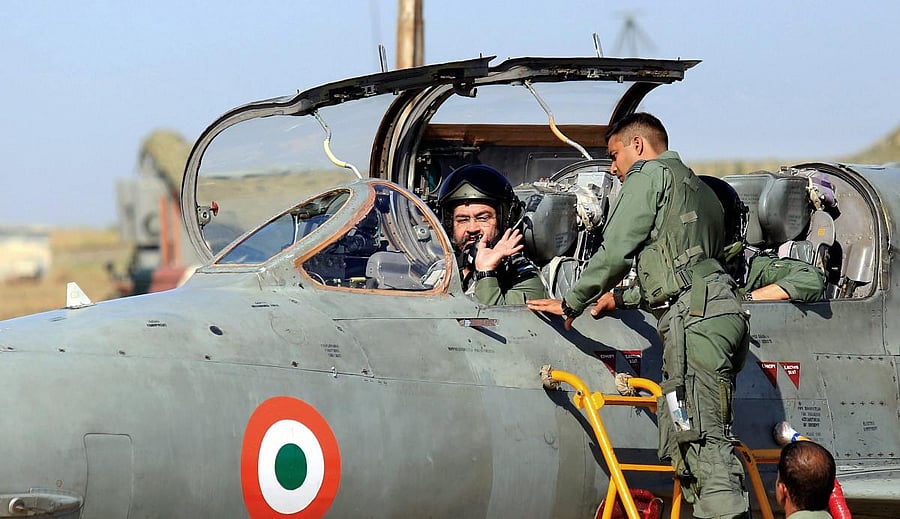 Bathinda: Air Chief Marshal Birender Singh Dhanoa sits in the cockpit of a MIG 21 fighter plane before flying a 'missing man' formation, an aerial salute to honour martyr Squadron Leader Ajay Ahuja, at Bhisiana Air Force station, in Bathinda, Monday, May