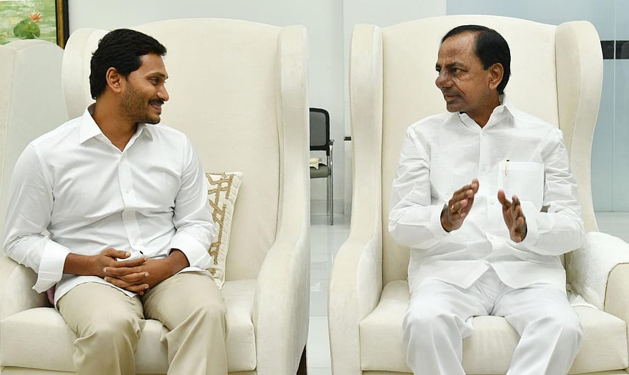 YSR Congress Party president and newly elected Andhra CM, YS Jagan Mohan Reddy (L) talks to Telangana CM, K Chandrasekhar Rao (R) in Hyderabad. AFP photo