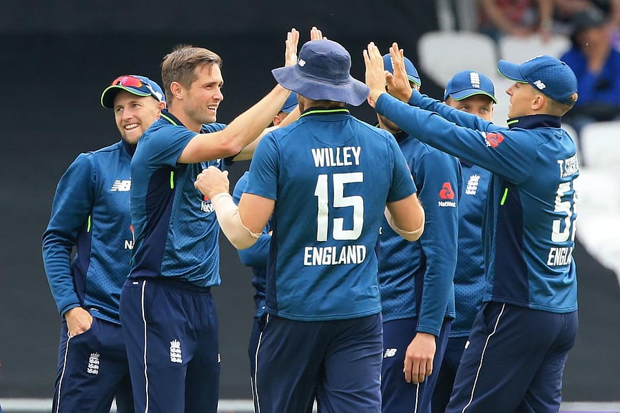 WRECKER IN CHIEF England's Chris Woakes (second from left) celebrates with team-mates after taking the wicket of Pakistan's Mohammad Hafeez. AFP