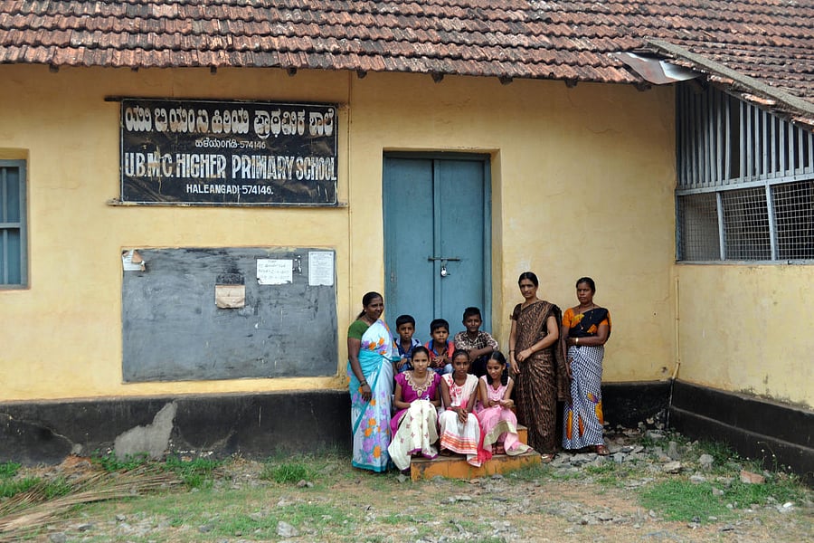 Parents and teachers in front of the 180-year-old UBMC Higher Primary School at Haleyangady.