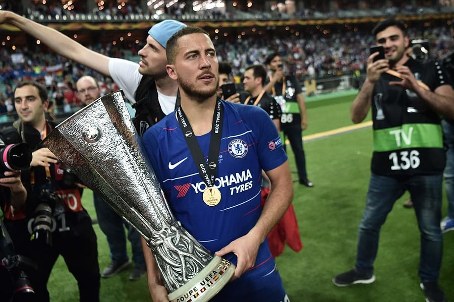Chelsea's Belgian midfielder Eden Hazard holds the trophy after winning the UEFA Europa League final football match between Chelsea FC and Arsenal FC at the Baku Olympic Stadium in Baku, Azerbaijian. (AFP Photo)