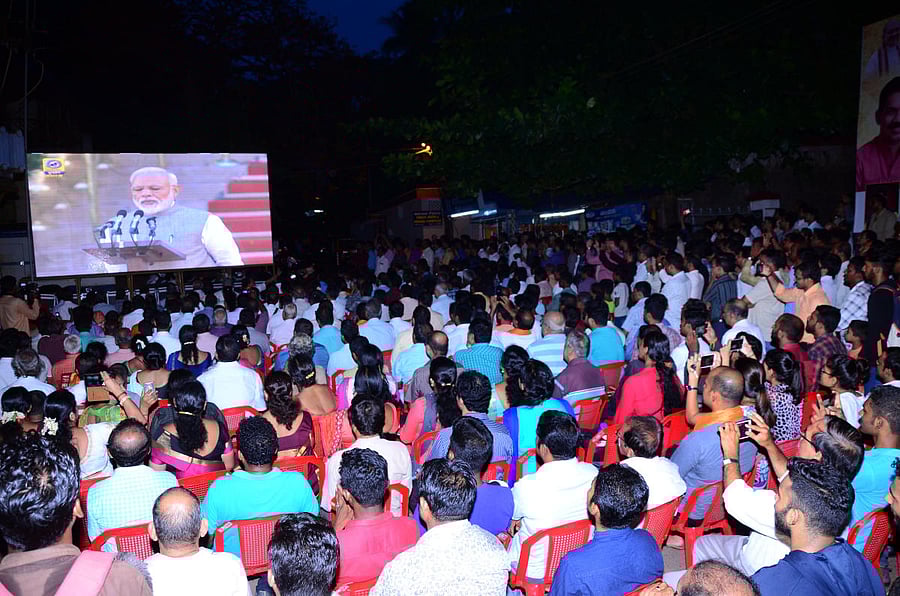 Audience at the screening of Prime Minister Narendra Modi’s swearing-in ceremony organised near BJP’s office at PVS Circle, Mangaluru on Thursday evening.