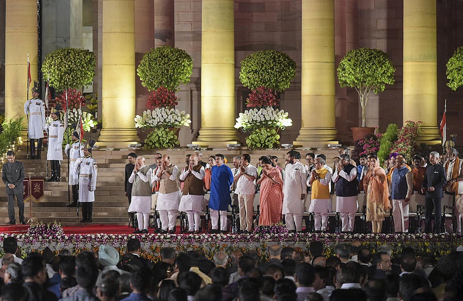 Prime Minister Narendra Modi and the newly sworn-in council of ministers after the oath-taking ceremony at Rashtrapati Bhavan in New Delhi onThursday. (PTI Photo)