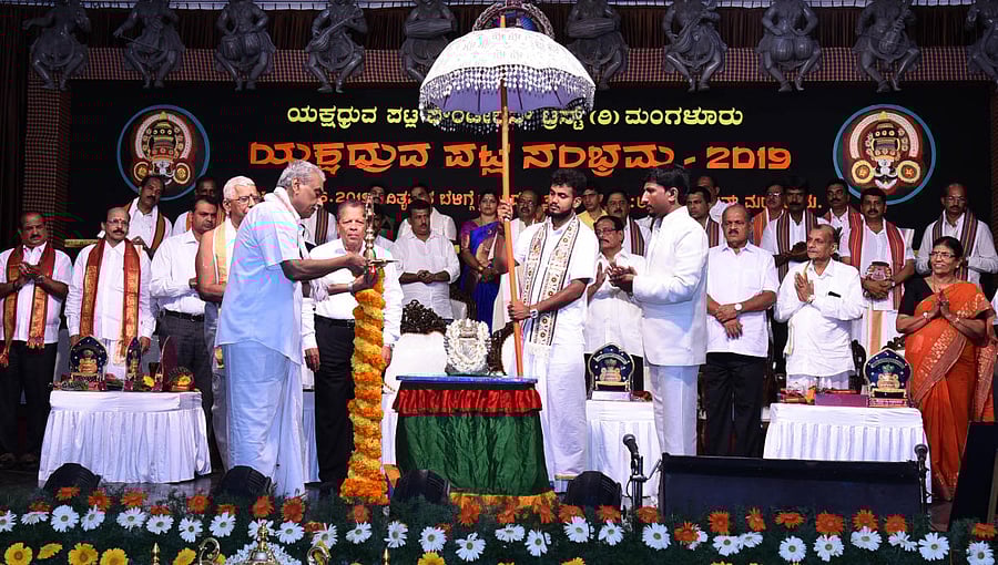 Sri Kshetra Madhuru Managing Committee Chairman U T Alva inaugurates ‘Yakshadhruva Patla Sambhrama 2019’ at Adyar Garden, Adyar, in Mangaluru on Sunday.